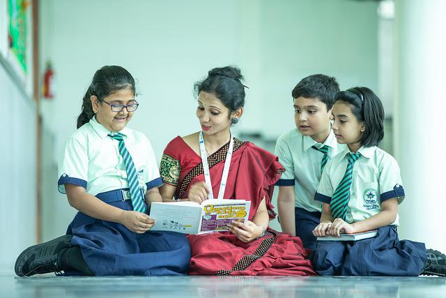 Figure 1: Teacher with students in India.